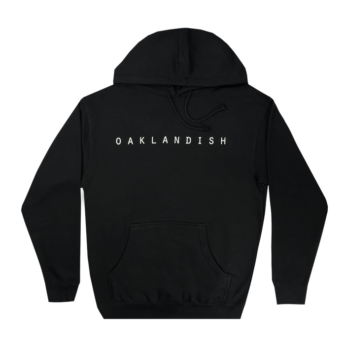 The Oaklandish Classic Hoodie by Oaklandish is a plain black pullover featuring a front kangaroo pocket and drawstring hood. "OAKLANDISH" is printed in bold, white, capital letters across the chest, celebrating Oakland roots. The men's fit hoodie is displayed flat against a white background.