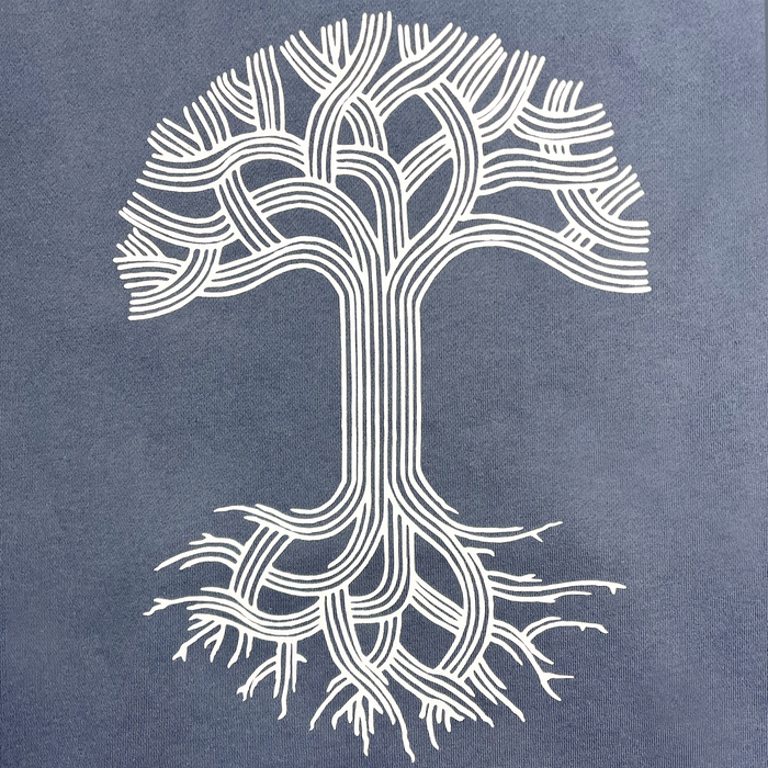 The Oaklandish Classic Hoodie from Oaklandish features a stylized white tree illustration on a storm blue background. The tree consists of an intricate pattern of interconnected, parallel lines forming symmetrical branches and roots, resulting in an elegantly complex design. This minimalist representation on the pullover hoodie embodies Oakland pride through its organic flow and interconnectedness.