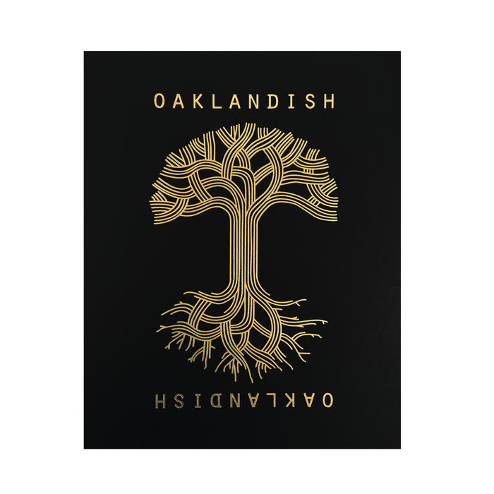 The Oaklandish Classic Logo Print by Never Elsewhere features a black poster adorned with a gold stylized tree design. The tree's branches and roots are interwoven to resemble circuitry, forming a symmetrical and mirrored image. "OAKLANDISH" is elegantly inscribed in copper and metallic gold foil across the top and bottom, with the bottom text presented in an inverted fashion.