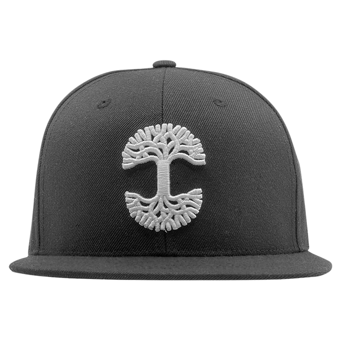The Oaklandish Classic Snapback by Oaklandish is a black hat featuring a white embroidered tree logo with evenly spreading branches on the front. The design includes a flat brim, a button on top, and visible stitching details on the crown and brim.