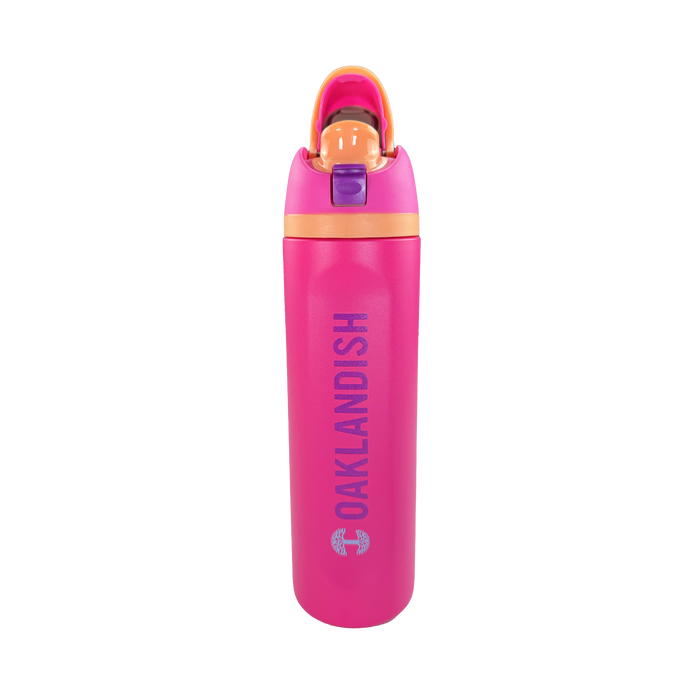 The Oaklandish Colorful Bottle by Oaklandish is tall and bright pink, featuring an orange lid, a purple flip-top spout, and "OAKLANDISH" in large silver letters down the front. The background is plain white.