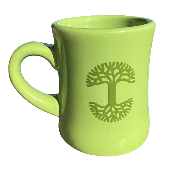 The Oaklandish Diner Mug by Oaklandish is a lime green ceramic piece featuring a sturdy handle and an embossed tree design on its side. This stunning drinkware showcases symmetrical branches and roots forming a circle, with the glossy finish highlighting the intricate design against the simple backdrop.