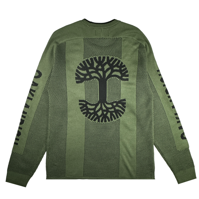 The Oaklandish Terrace Sweater is a men’s green knit with a black stylized tree on the back, black dot patterns, and “OWNTURN” printed on both sleeves. The bold army-inspired design is by brand Oaklandish.
