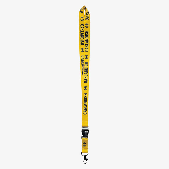 Yellow lanyard with black Oaklandish word mark and tree logos on repeat with a detachable clip with Oaklandish tree logo.
