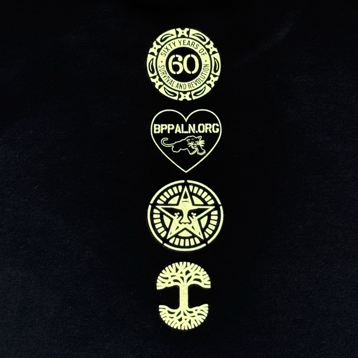 The Obey x BPPALN x Oaklandish 60th Educate to Liberate Tee from Oaklandish features a black background with four yellow logos: a 60th anniversary emblem, heart with panther and "BPPALN.ORG," star with eagle, and a tree with roots and branches.