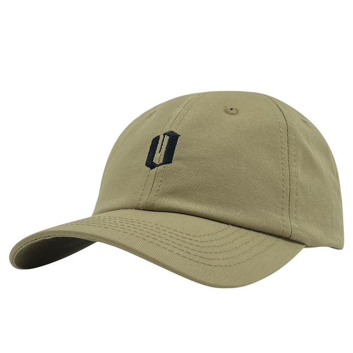 The Official Micro Logo Dad Hat from Oaklandish is a khaki green Dad hat with a curved brim, adorned with a black embroidered logo on the front. The abstract design resembles the letter "U." This cap features visible stitching, a button on top, and an adjustable strap for a perfect fit. The background is plain white.