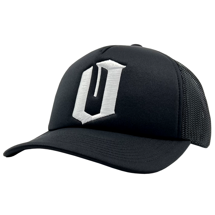 The Official O Trucker by Oaklandish is a sleek and modern black trucker snapback baseball cap. It features a curved brim and a breathable mesh back. The front panel showcases an embroidered white "O" design in a stylized, angular font, combining solid fabric on the front with mesh for optimal comfort.
