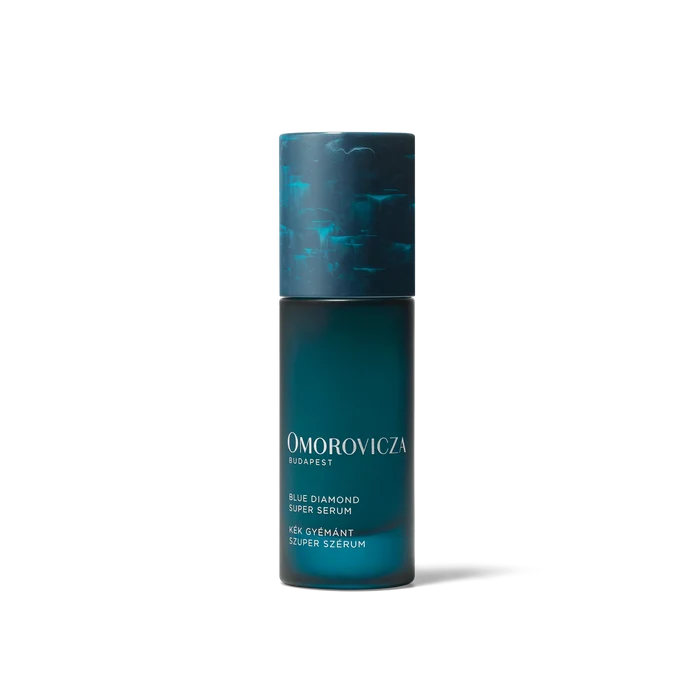 Omorovicza Blue Diamond Super Serum in 30ml bottle, featuring a sleek blue packaging and applicator for radiant skin.