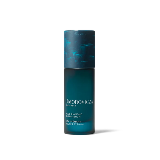 Omorovicza Blue Diamond Super Serum in 30ml bottle, featuring a sleek blue packaging and applicator for radiant skin.
