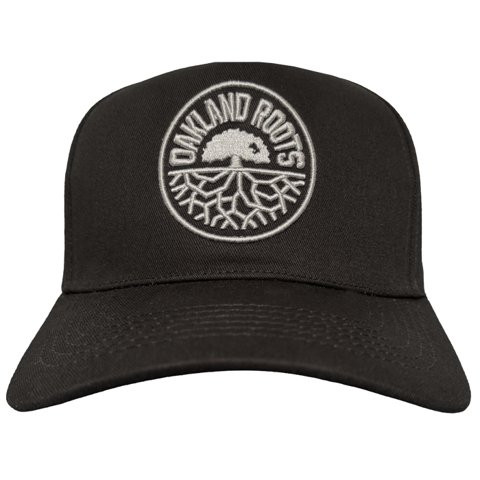 The ORSC 5 Panel Hat by Oakland Roots SC is a black cap featuring a white circular logo with a tree and bold "OAKLAND ROOTS" lettering, making it the perfect accessory for Oakland sports fans.