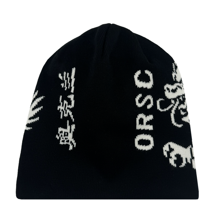 The ORSC Dragon Skully by Oakland Roots SC is a black knit beanie with white graphic designs, including "ORSC" lettering, stylized Asian characters, and abstract shapes. Inspired by Roots SC & Soul, it is shown on a white background.