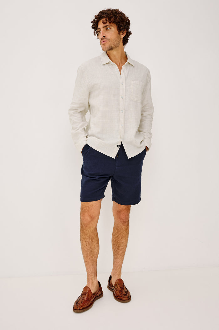 Owens Shirt in Lightweight Cotton With Front Buttons, Subtle Texture, Collar, Long Sleeves, and Chest Patch Pocket in Desert Path Colorway - Full Body Front View Featured on Model