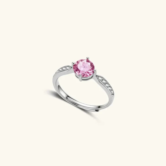 Pink Dreams Moissanite ring in polished silver, featuring a round pink centre stone and clear pavé-set shoulder accents.