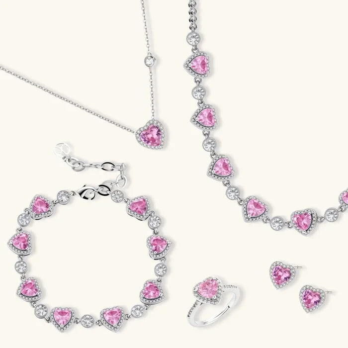 Pink Heart Zirconia four-piece jewelry set with silver-tone necklaces, bracelet, ring and earrings featuring heart-shaped pink stones