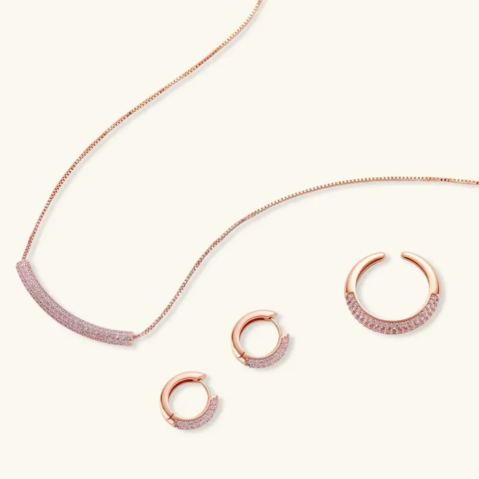 Pink Pavé Zirconia Necklace set in rose gold-tone metal with a curved pink pavé pendant, hoop earrings and open ring
