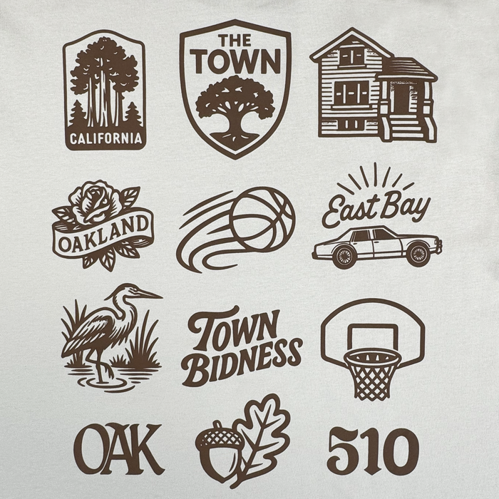 A grid of twelve black Oakland-inspired icons—including a heron, shield, "Town Bidness," basketball, and "510"—is featured on the white Pirate Black-Letter LS Tee by Other. Part of the exclusive Town Collection, this design celebrates Warriors x Oaklandish heritage with playful local motifs like an acorn and leaf, trees, a house, rose, car, basketball hoop, and bold “OAK.”.