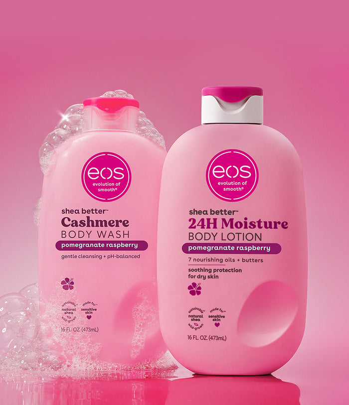 Two pink bottles of eos body wash and lotion on a pink background