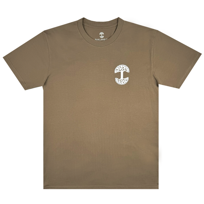 The Posy Tee by Oaklandish is a brown T-shirt crafted from soft cotton, featuring a small white tree logo on the left chest and a round neckline. The word "ANALOGY" is printed inside the collar above the logo. As part of our latest collection, this laid-flat T-shirt is showcased against a white background.