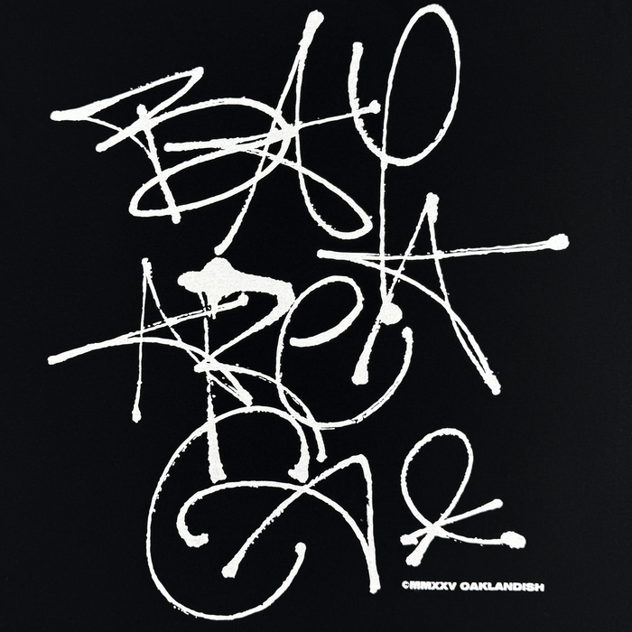 The Oaklandish Presto Tee features white graffiti-style “BAY AREA CAL” text on black, with scribbled, splattered street art vibes. Part of the men’s collection, this classic-fit heavyweight cotton tee has a “© MIDXY OAKLANDISH” at the bottom right.