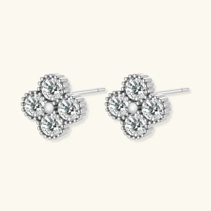 Quatrefoil Moissanite Stud Earrings in polished silver, with four round clear stones and beaded clover-shaped borders