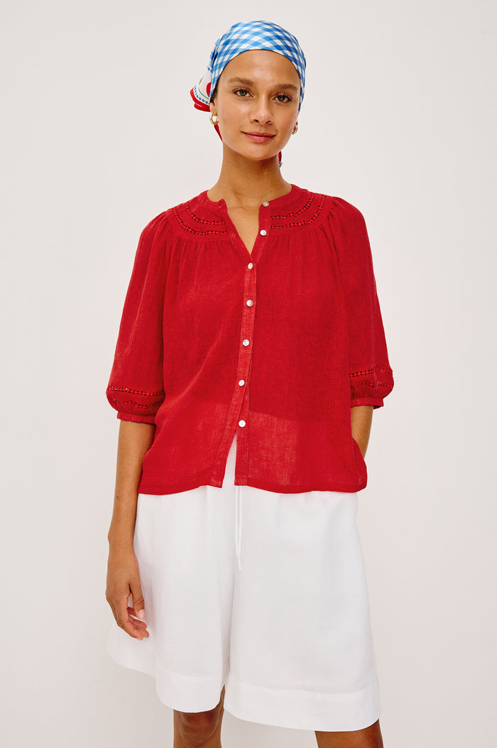 Theia Top in Luxe Linen With Crew Neckline, Front Buttons, Relaxed Fit, Embroidered Detailing, and Elbow-Length Puff Sleeves in Tomato Colorway - Upper Body Front View Featured on Model