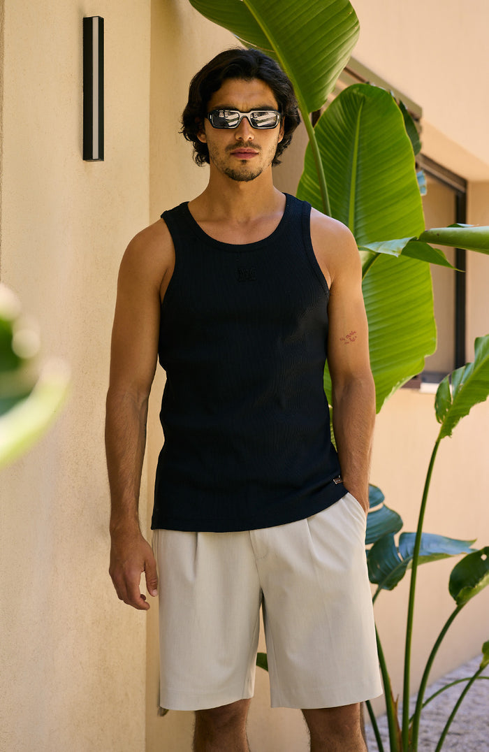 Relaxed Pleated Bermuda Shorts in Beige