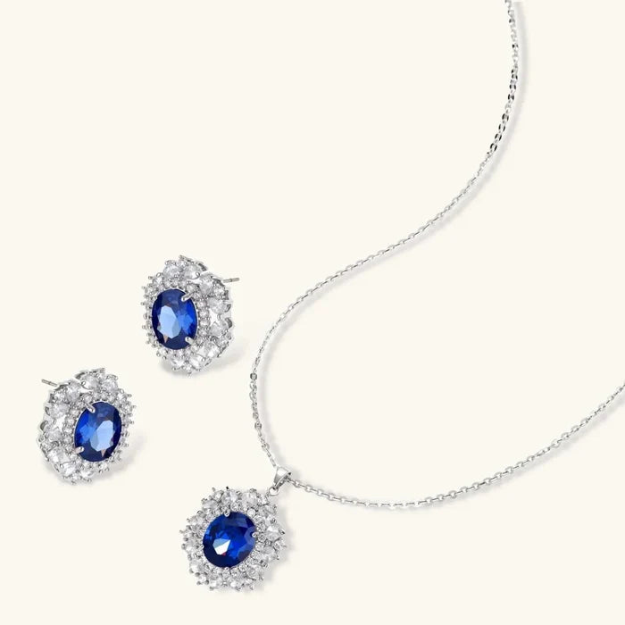 Royal Blue Zirconia Halo Necklace set with a silver-tone chain, oval blue stones, clear double-halo pendant and matching stud earrings