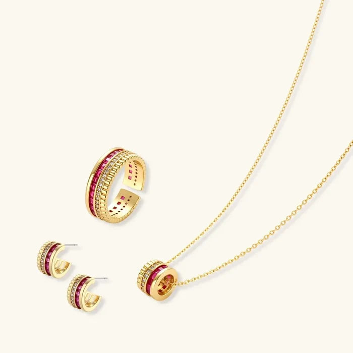Royal Ruby Red Zirconia jewelry set with gold-tone necklace, open ring and huggie earrings, featuring red stones and clear accents
