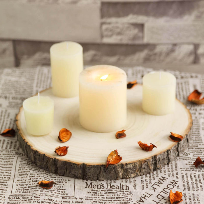 Decorative candles on a wood slice with dried petals, creating a cozy ambiance.