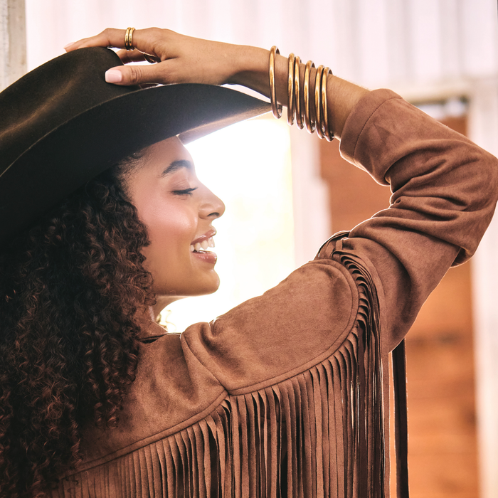 a woman wearing a cowboy hat