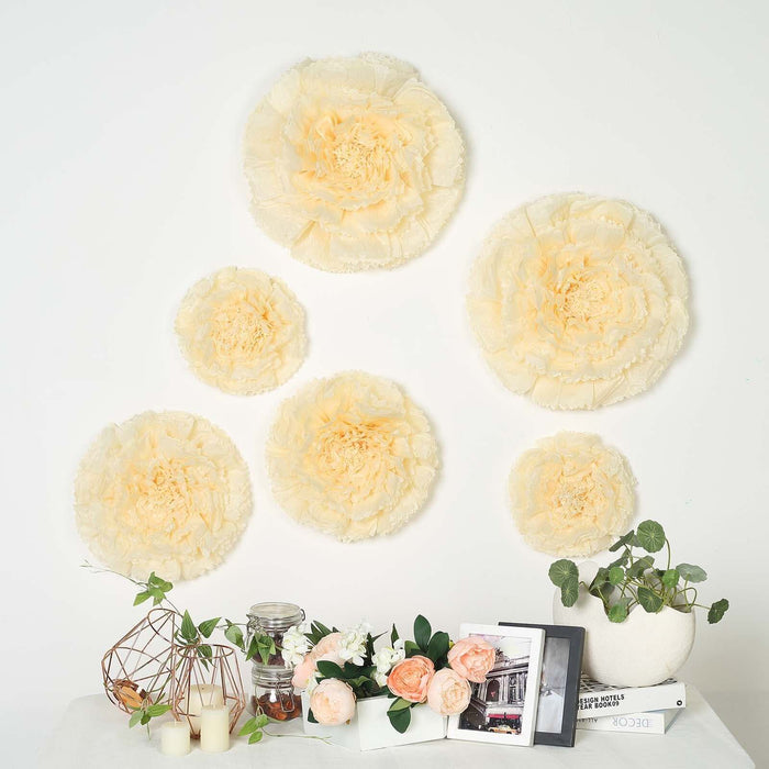Peach floral wall decor set, five layered paper flowers in various sizes.