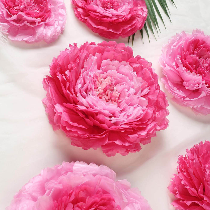 Pink peony flower decorations arranged on a soft background.