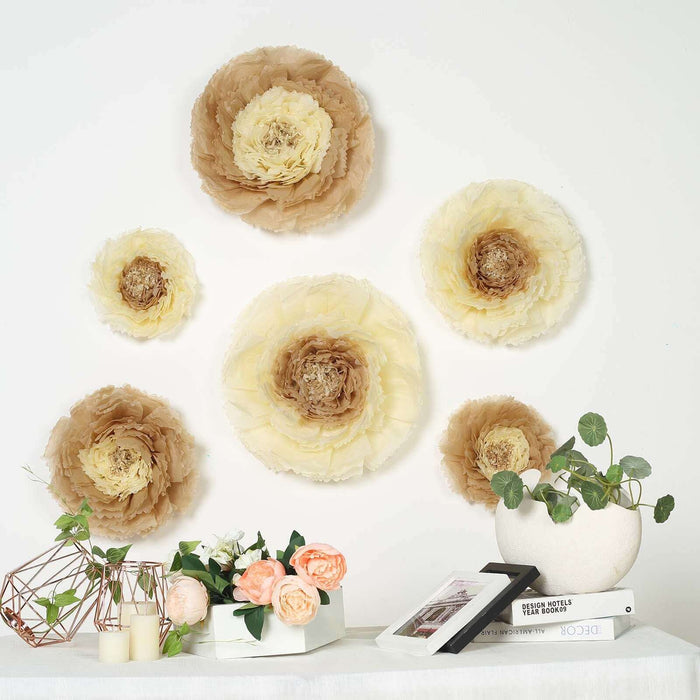 Decorative paper flowers in neutral tones on a wall with a floral arrangement and decor.