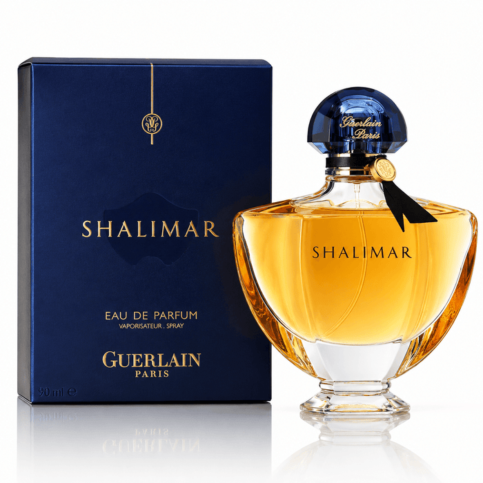 Guerlain Shalimar EDP amber perfume in a clear glass bottle with a dark blue cap and matching navy box