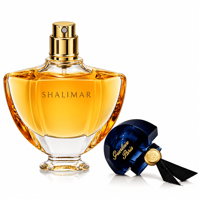 Guerlain Shalimar EDP in a golden amber glass bottle with a gold spray nozzle and dark blue ribboned stopper
