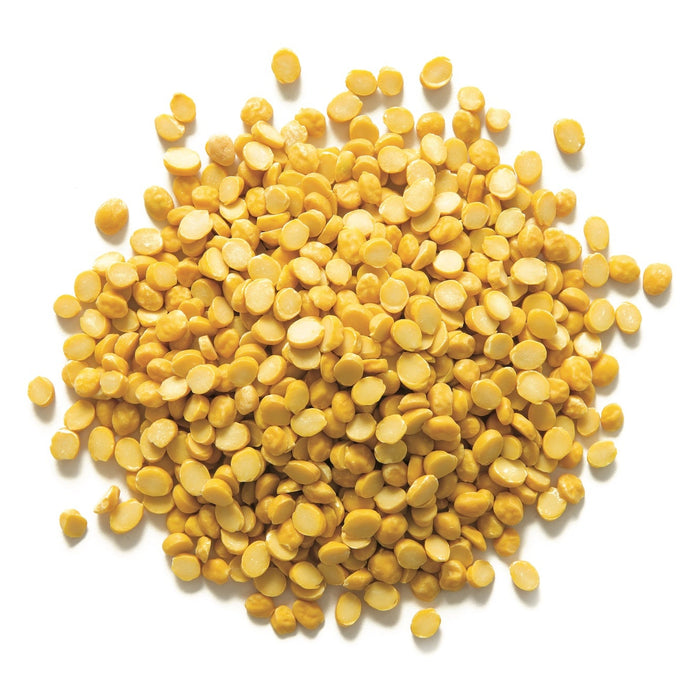 Yellow split peas on a white background