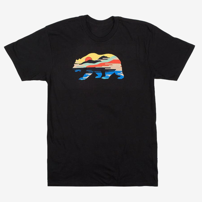 The Sunset Bear Full T-shirt from Never Elsewhere is a black, 100% cotton shirt featuring a stylized design of a California grizzly silhouette filled with a colorful landscape. Inside the bear shape, a red sun, mountains, trees, and blue water are depicted in a horizontal stripe pattern. This T-shirt has short sleeves and a round neck.