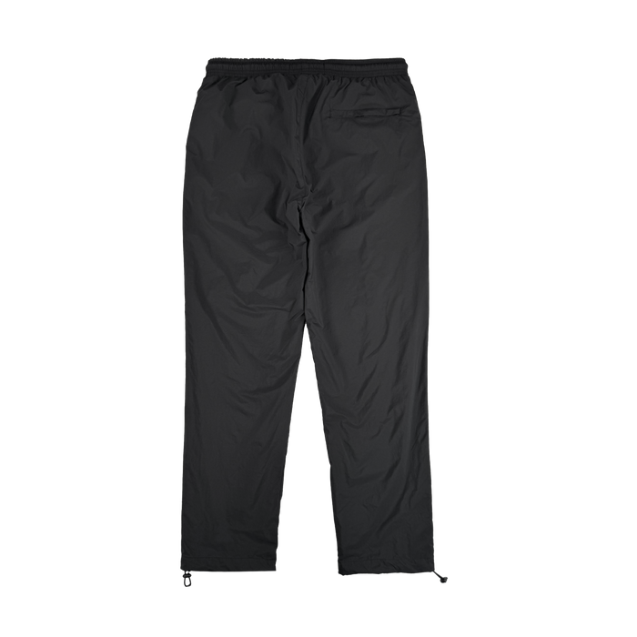 The Susurrus Track Bottom by Oaklandish is a pair of black nylon pants with an adjustable waistband, straight legs, and ankle drawstrings. Lightweight and versatile, they're ideal for casual or athletic wear. Displayed flat on a white background.