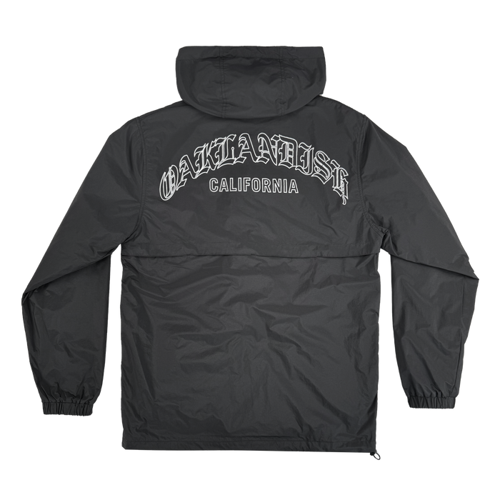 The Susurrus Track Top by Oaklandish is a black men’s hooded windbreaker with elastic cuffs and relaxed fit, featuring “OAKLANDISH CALIFORNIA” in bold white gothic lettering across the upper back. Shown flat on a white background.