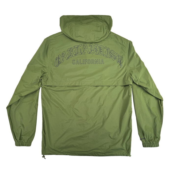 The Susurrus Track Top by Oaklandish is a light olive green men's nylon jacket with a classic fit, elastic cuffs, and a back seam. “OAKLANDISH CALIFORNIA” is boldly printed across the upper back. Shown flat, back facing up.