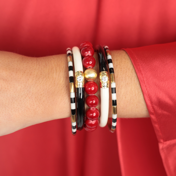 a person wearing bracelets on their wrist