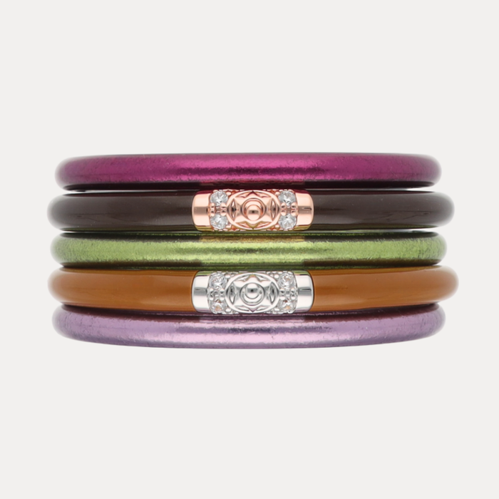 a stack of colorful bracelets