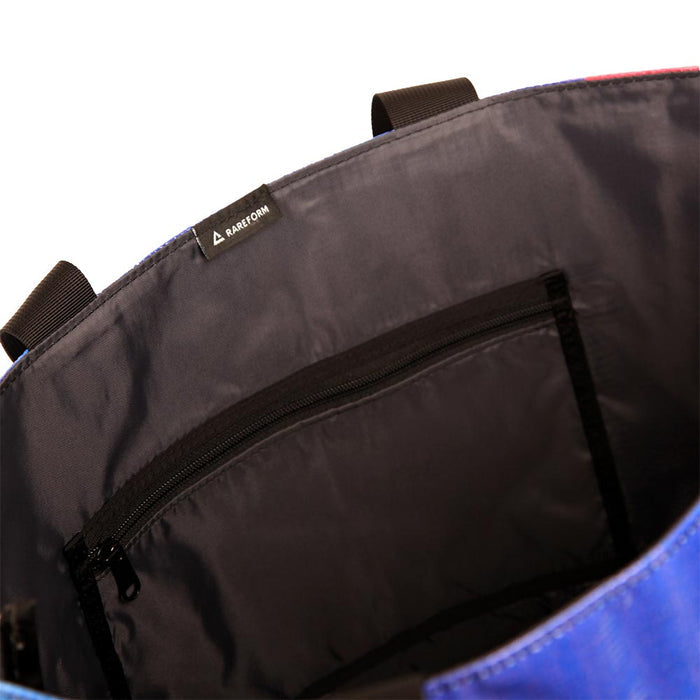 The Essential Tote for carrying your personal and cake items around with you. Made with recycled billboard material.