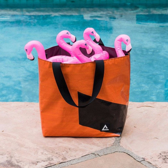 The Essential Tote for carrying your personal and cake items around with you. Made with recycled billboard material.