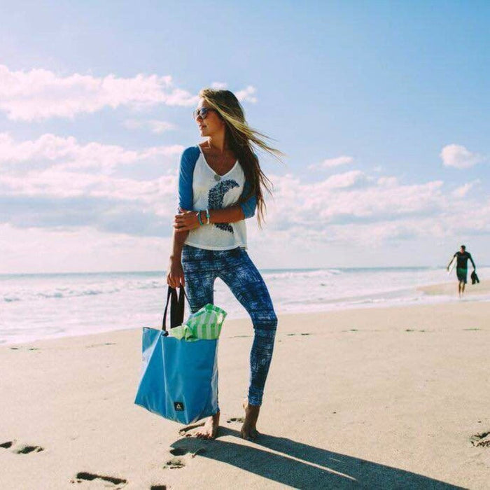 Tote for carrying your personal and cake items around with you. Made with recycled billboard material.