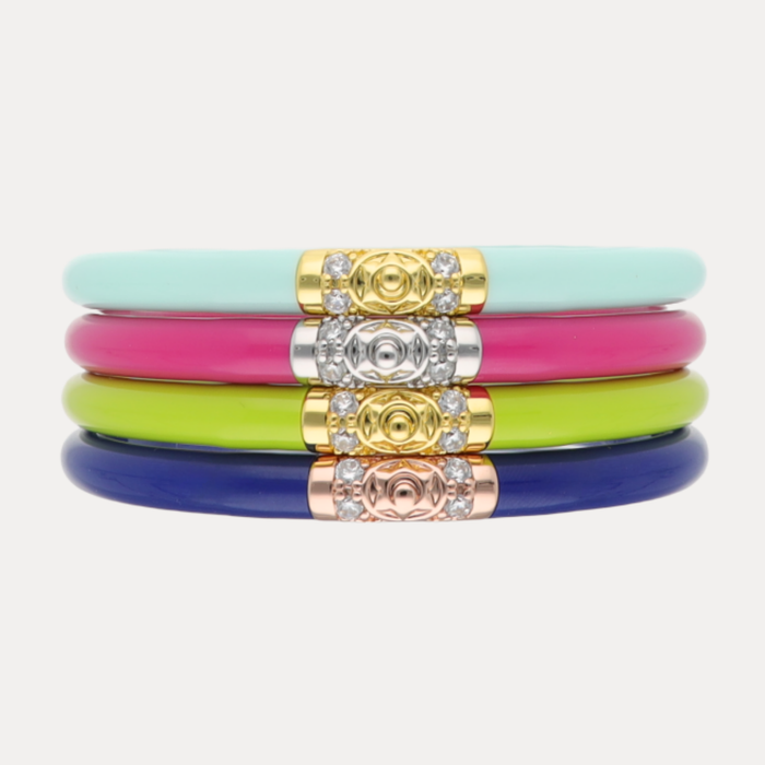 a stack of colorful bracelets