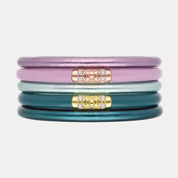 a stack of colorful bracelets