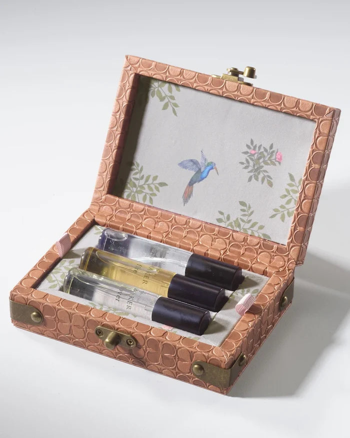 Empty embossed leather travel perfume trunk from The Maker, featuring compact SLG design and intricate embossed details.