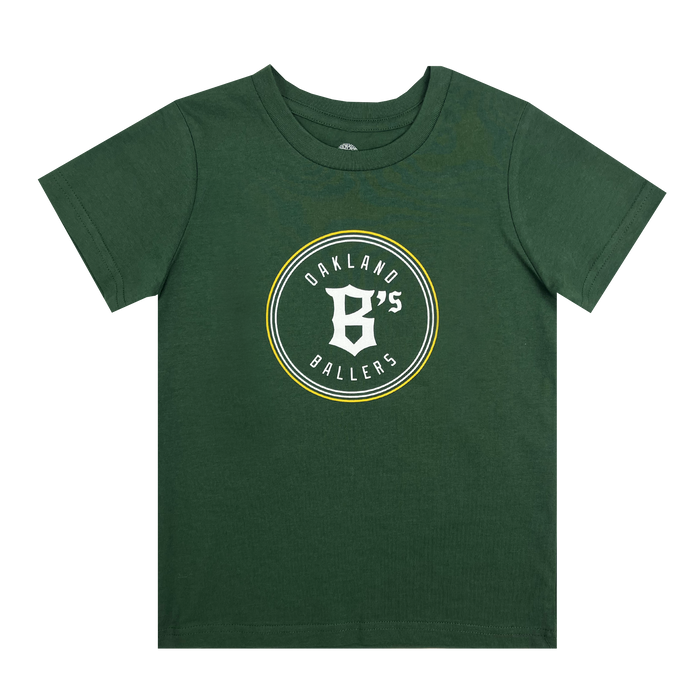 The Toddler Oakland Ballers Logo Tee by Oakland Ballers is a green, short-sleeved T-shirt featuring a circular logo in the center with the text "Oakland Ballers" celebrating their professional baseball team in the Pioneer League. The text and logo, displaying a large "B's," are in white and yellow. The shirt is laid out flat.