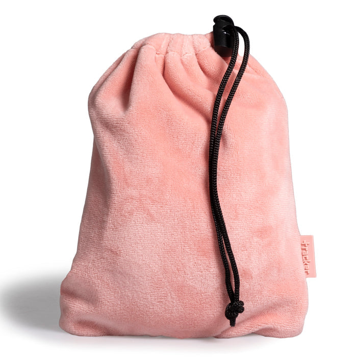 Pink fleece textured pouch with the drawstring dangling on its side show its tracker logo at the bottom right.